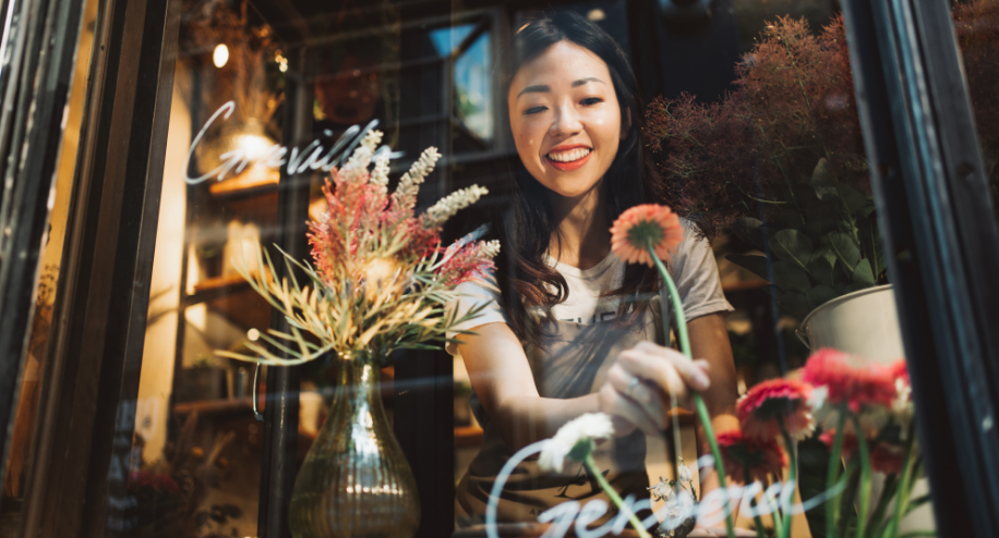 Picture of woman looking at flowers